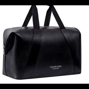 Calvin Klein Fragrance black duffel bag